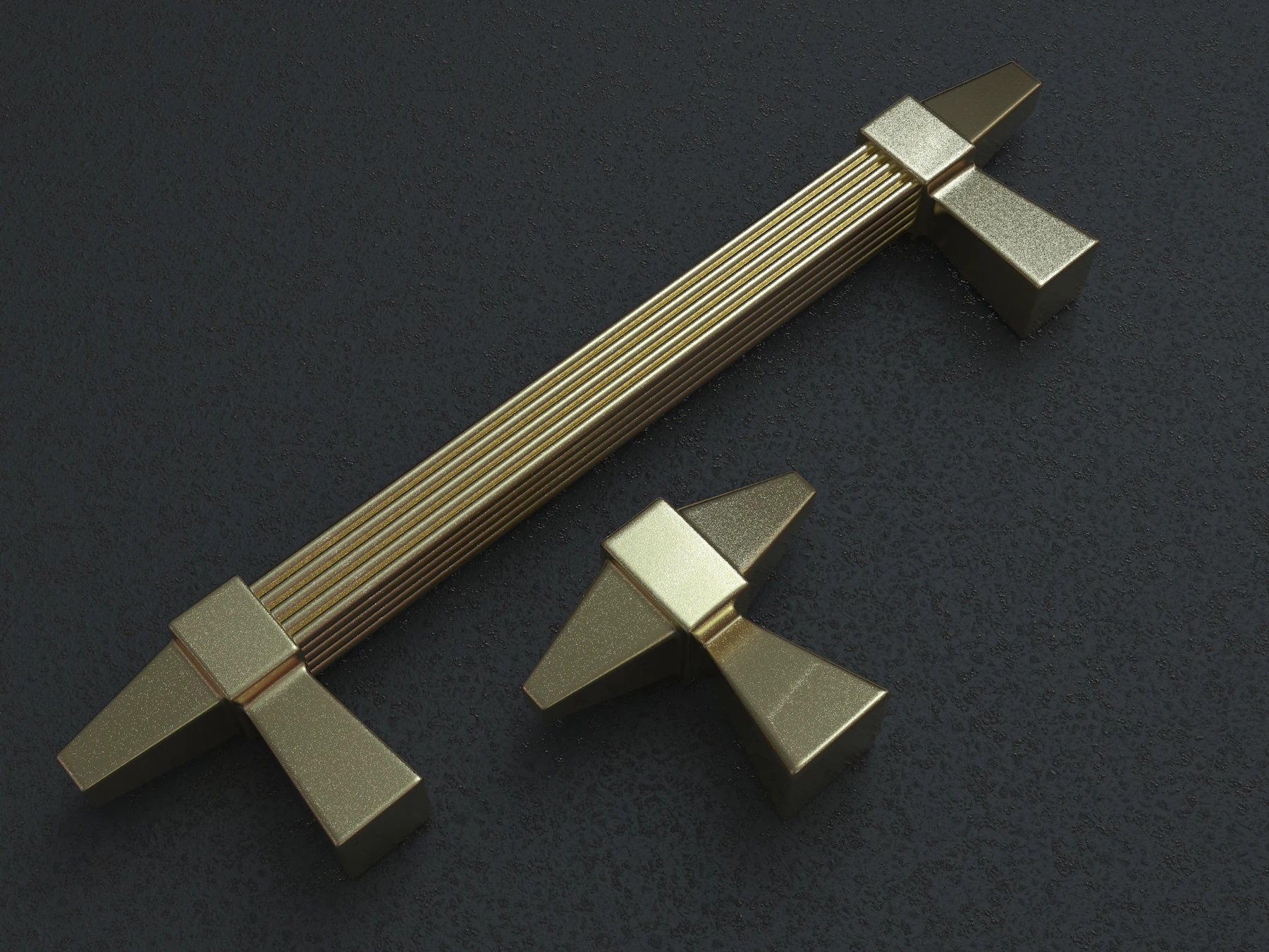 Fluted brass cabinet pull and knob on a dark surface